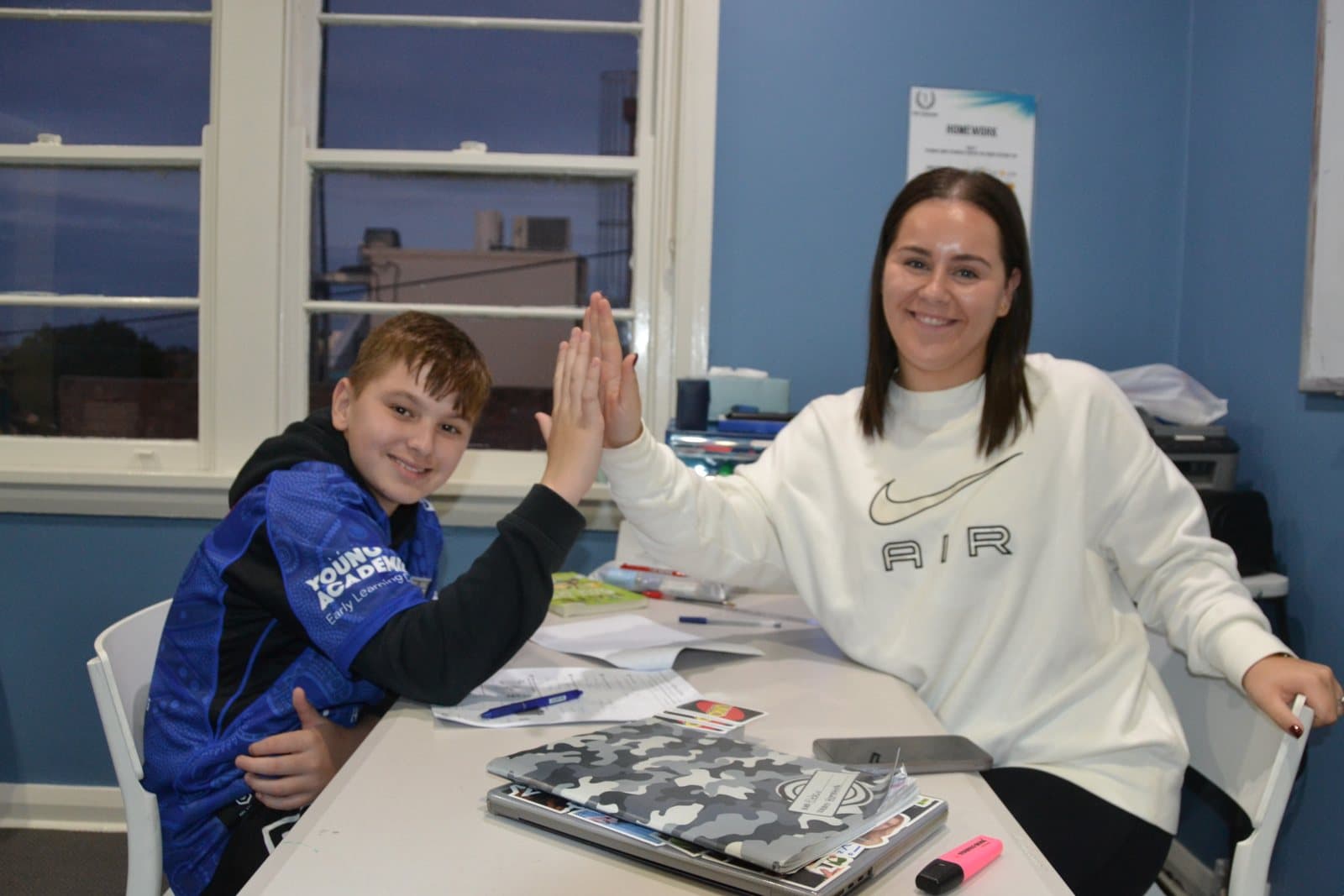 Tutor and students at a First Education centre