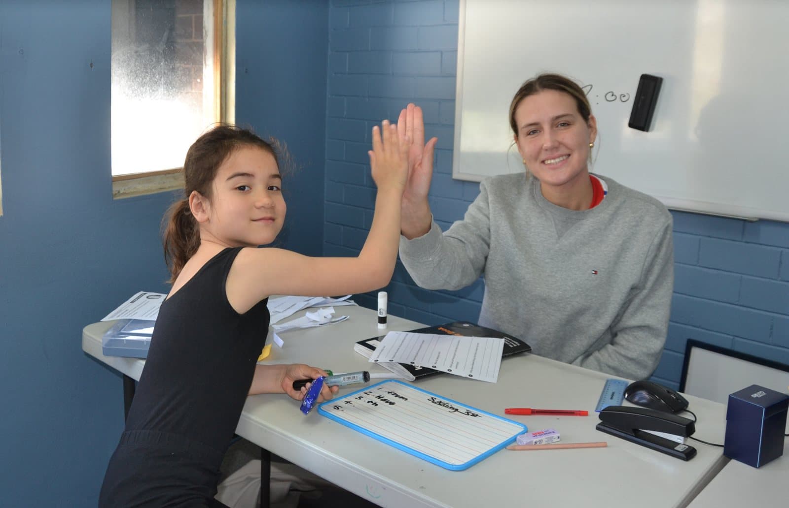 Tutors and Year 2 students at a First Education centre