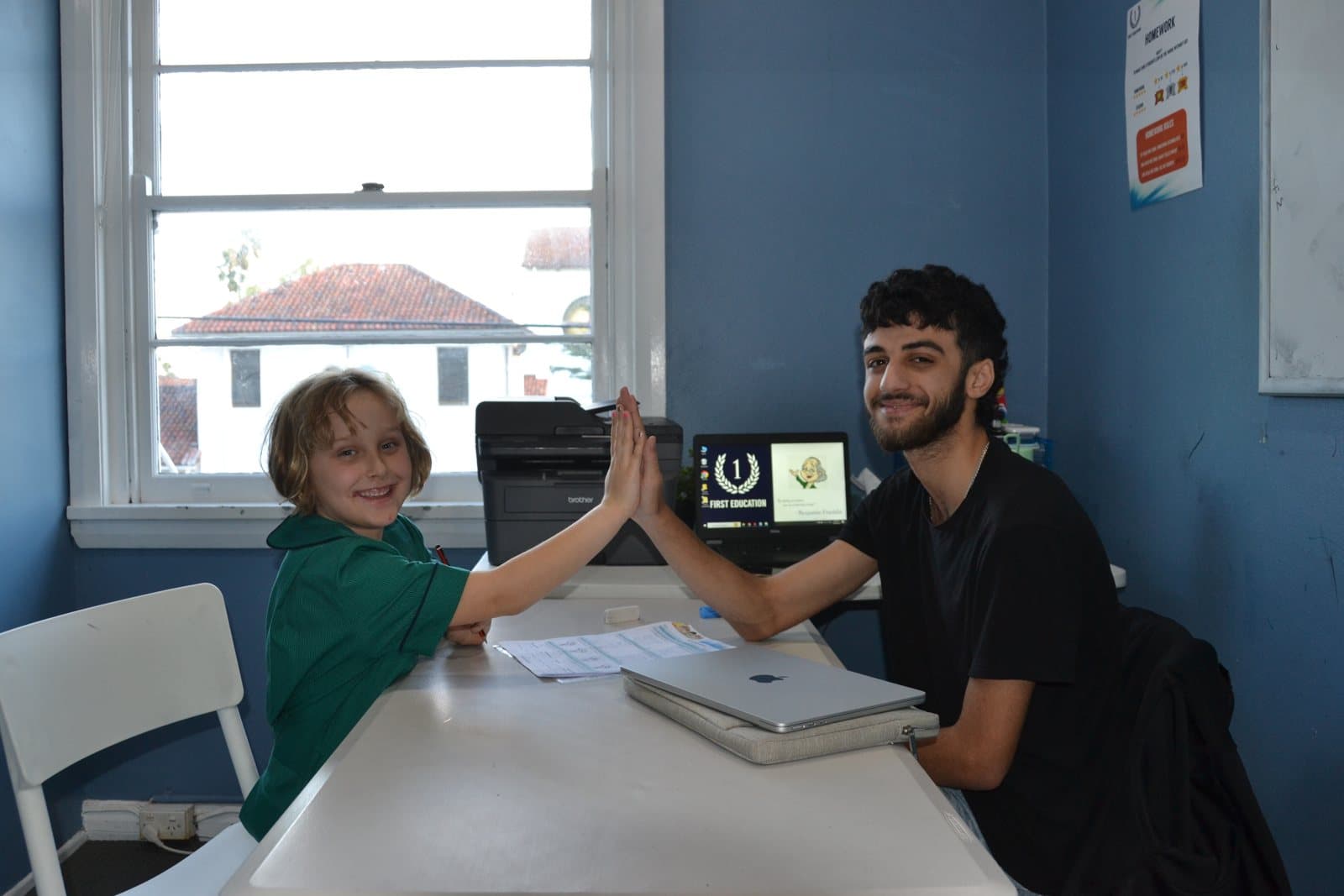 Tutors and students at a First Education centre