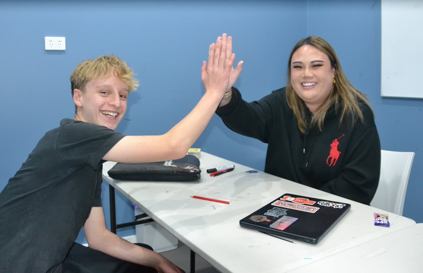 Tutors and students at a First Education centre