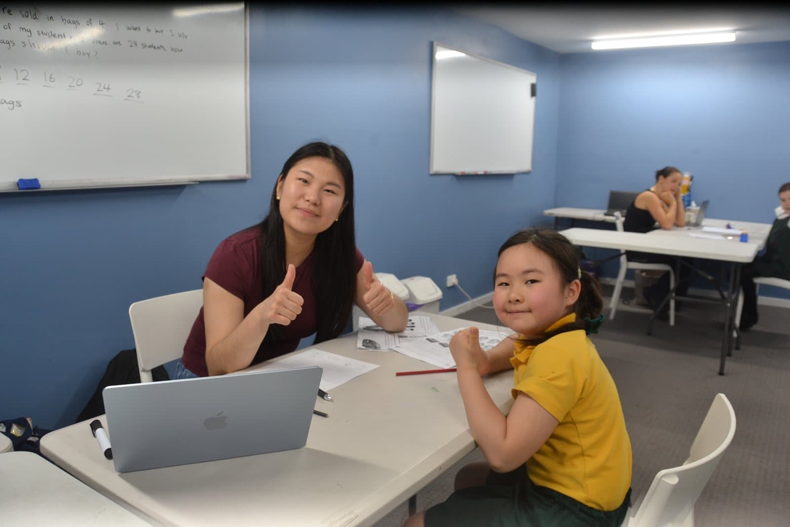 Tutors and students at a First Education centre