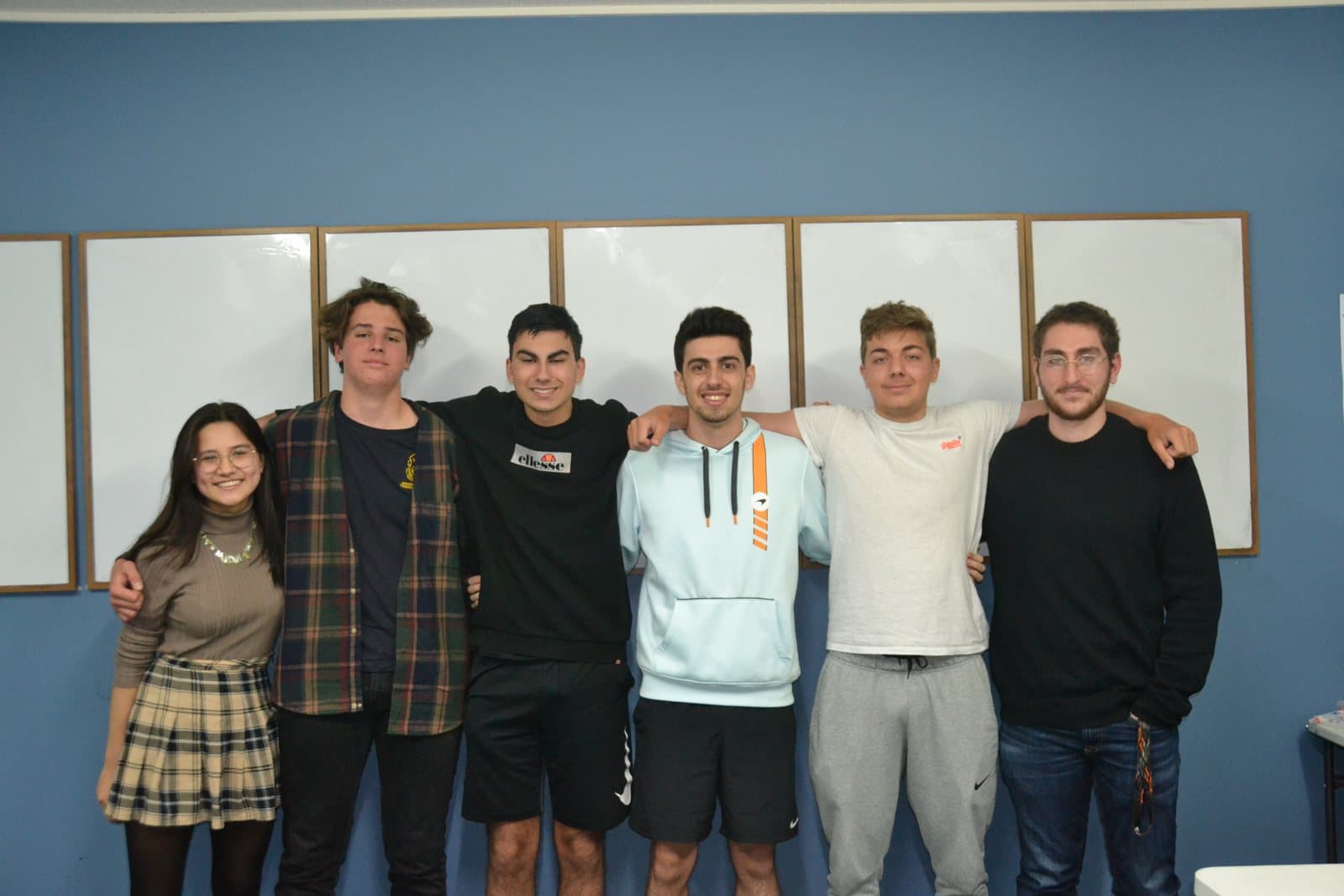 Tutors and HSC students with past papers at a First Education centre