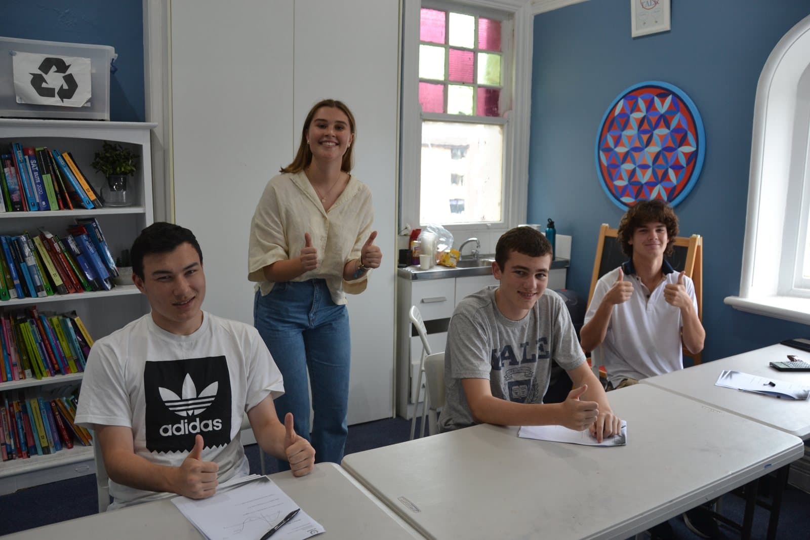 Tutors and HSC students with past papers at a First Education centre